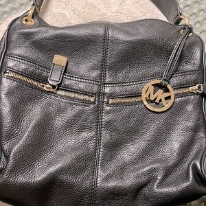 Black Michael Kors bag lots of compartments